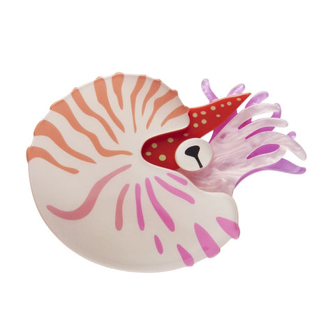 This Erstwilder layered resin Nautilus brooch in pale orange and pinks.