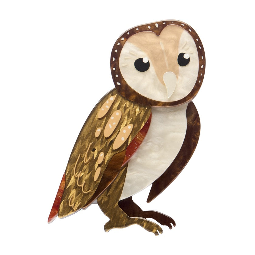 Owl brooch in brown, beige, and white resin colors on a white background