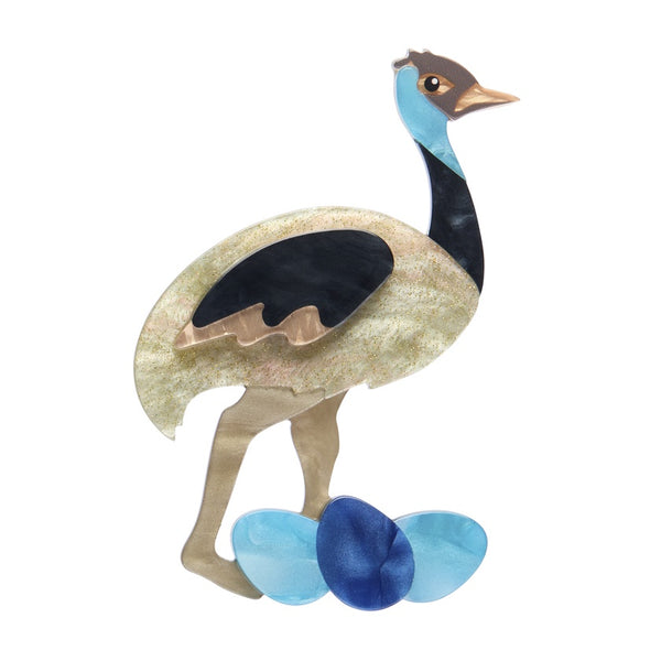 Colourful emu brooch in blue and brown resin on a white background