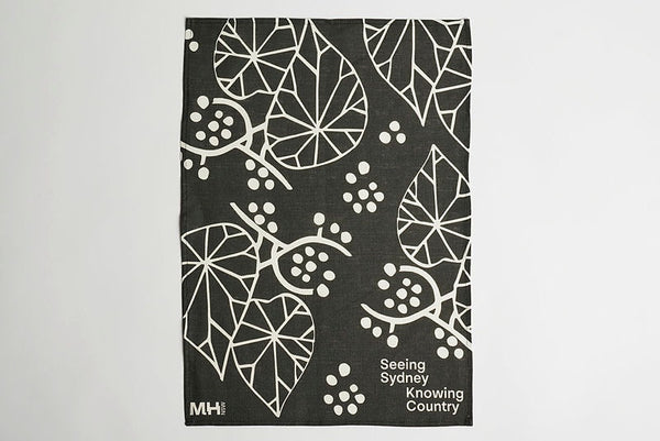 Tea towel with black and off-white pattern designed by Alison Page for MHNSW