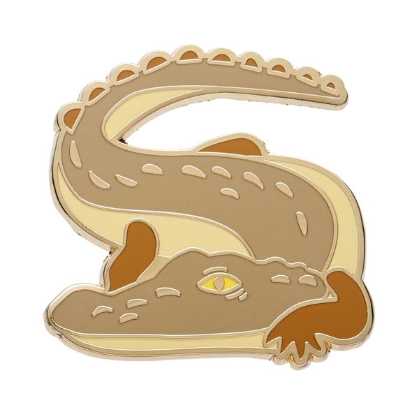 Saltwater crocodile pin with gold outline on a white background