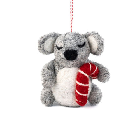 Felted wool koala Christmas ornament with a red and white striped candy cane on a white background