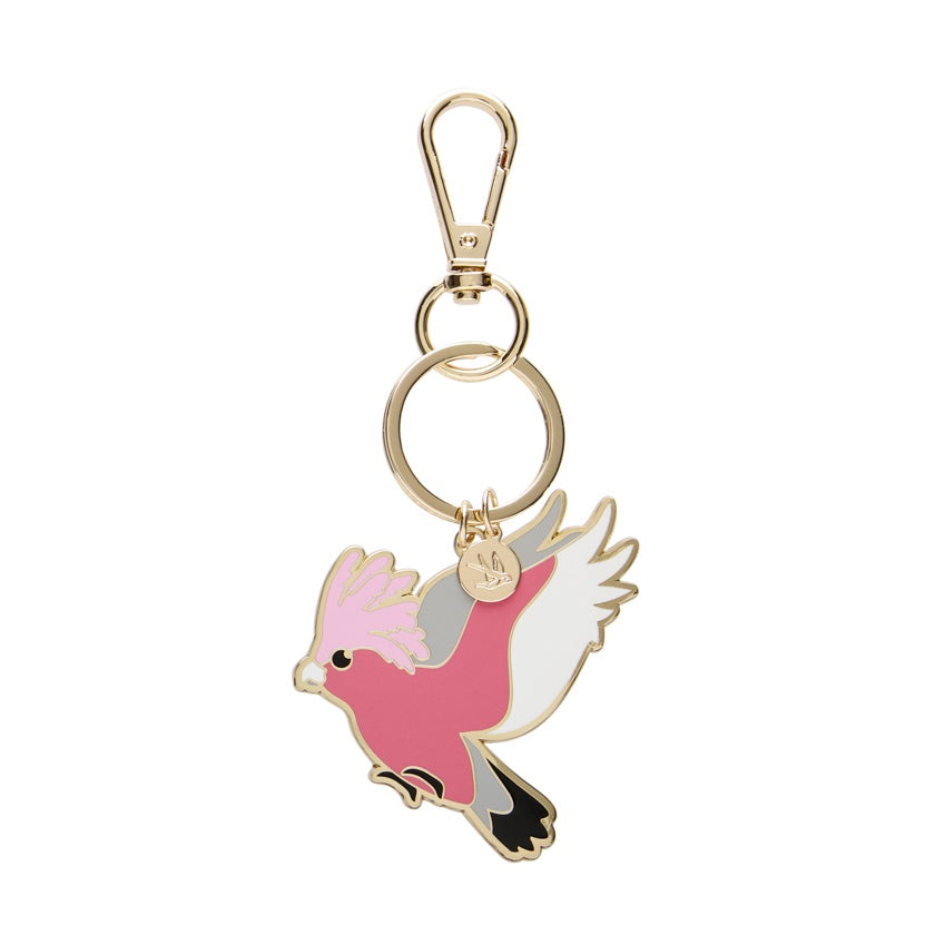 Enamel galah keychain with a pink and white design on a white background