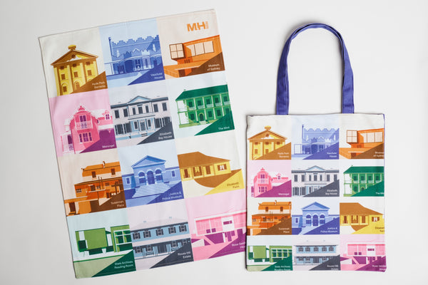 Colorful tote bag and tea towel set with architectural illustrations on a white background
