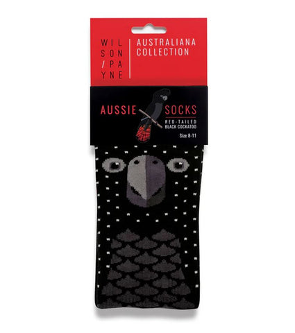 A pair of red-tailed black cockatoo themed socks packaged in a Wilson Payne header card.
