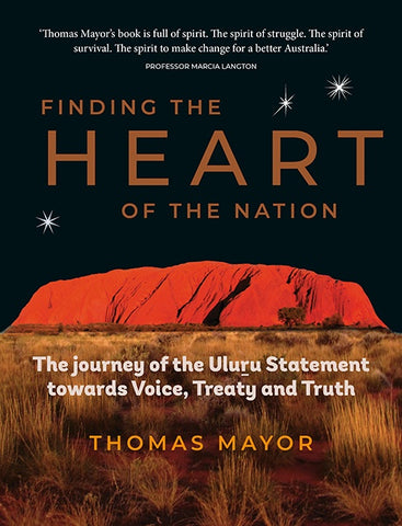 The cover of the book 'Finding the Heart of the Nation' by Thomas Mayor features a vibrant image of a sunset over Uluru, with the title and author's name at the top.