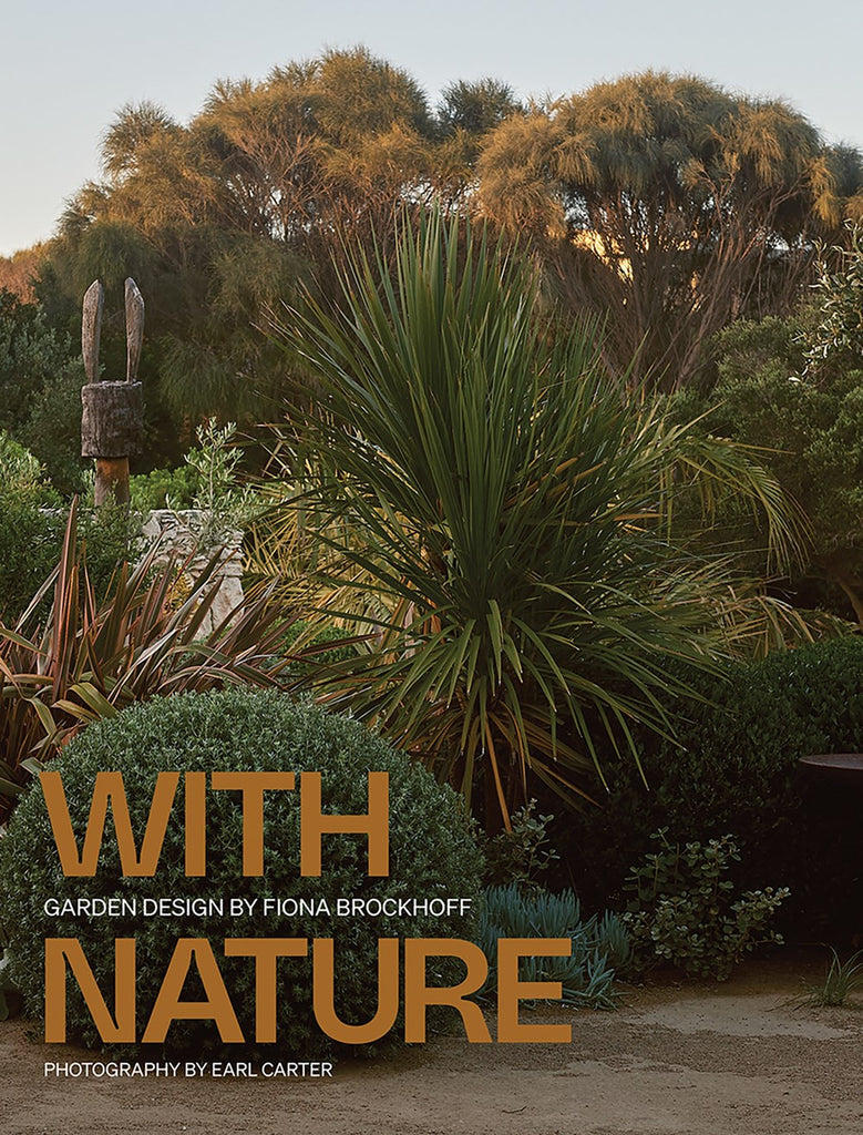 The cover of the book 'With Nature' by Fiona Brockhoff features a photograph of a garden with greenery and a text overlay that includes the title and the photographer's name.