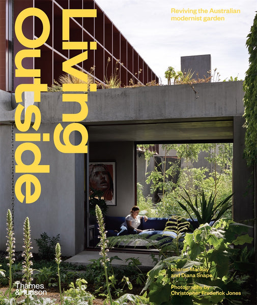 Cover of the book 'Living Outside' featuring a modern residential garden with a with plants and a contemporary house in the background.