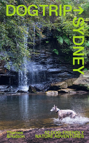 The image shows the cover of the book 'Dog Trip Sydney' featuring a title text, a green background, and a photograph of a dog with a waterfall in the background.