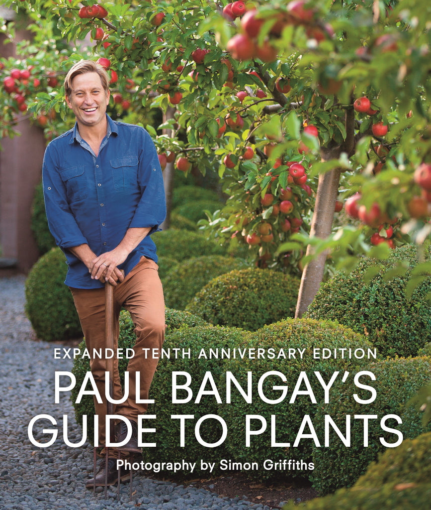 Cover of the book 'Paul Bangay's Guide to Plants: Tenth Anniversary Edition' featuring a photograph of Paul Bangay standing in a garden with apple trees.