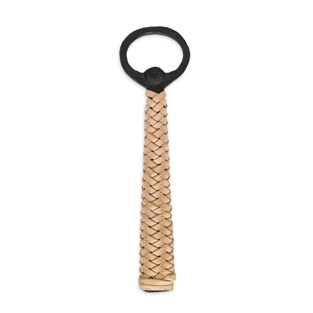 A bottle opener with a blackened iron handle and woven leather grip.
