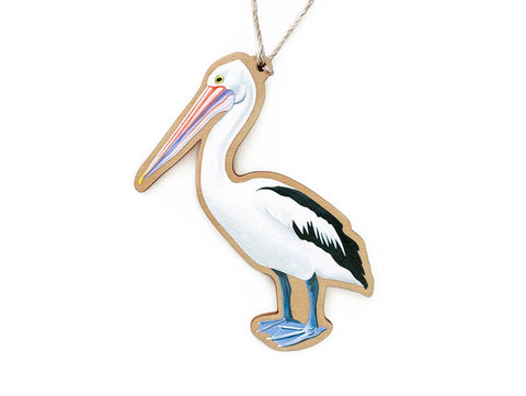 A wooden ornament in the shape of an Australian Pelican, with a colorful illustration printed on one side.