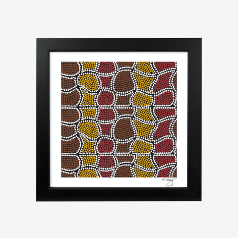 Square black framed First Nation's art print with brown, yellow, and red design on a white mount.