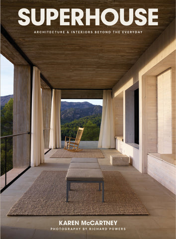 Book cover of 'SUPERHOUSE' with an ultramodern patio and mountain view.