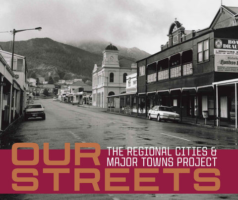 Black and white photograph of a town street scene with various buildings, titled 'Our Streets: The Regional Cities and Major Towns Project'.