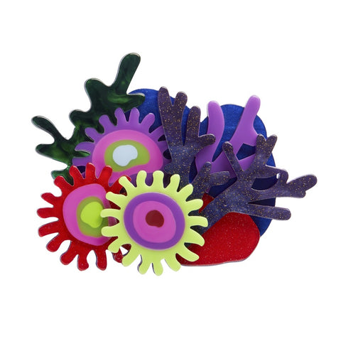 A colorful Erstwilder layered resin brooch featuring intricate coral designs in a mix of colors including purple, red and yellow.