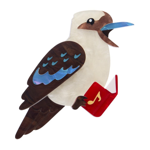 Erstwilder Kip the Kookaburra layered resin brooch features a carol singing kookaburra with a songbook in its feet.
