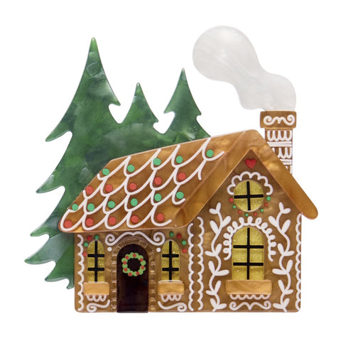 Erstwilder The Sweetest Cabin layered resin features a gingerbread house styled cabin with pine trees in the background.