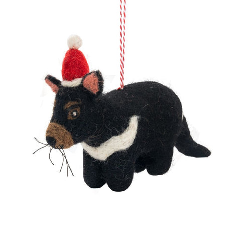 Tassie Devil felted wool Christmas ornament with a red Santa hat on a white background