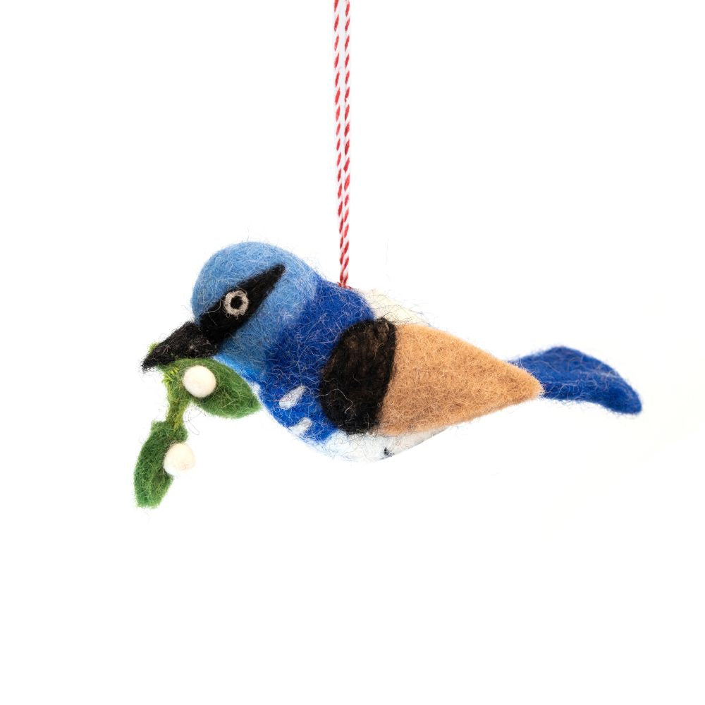Felted bird ornament with mistletoe on a white background