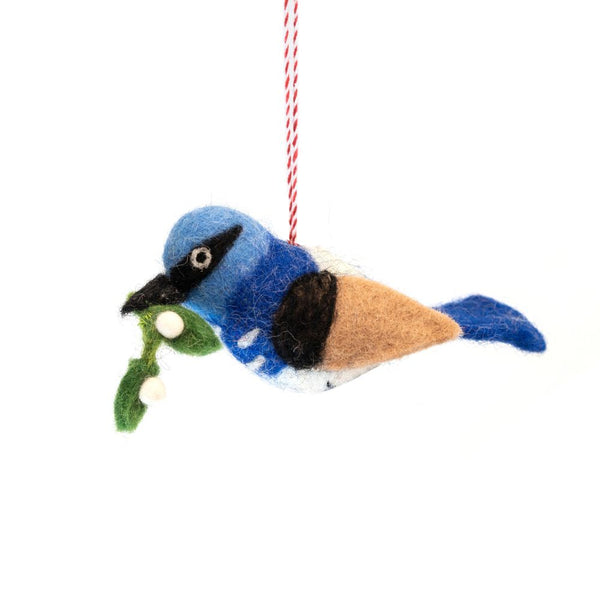 Felted bird ornament with mistletoe on a white background