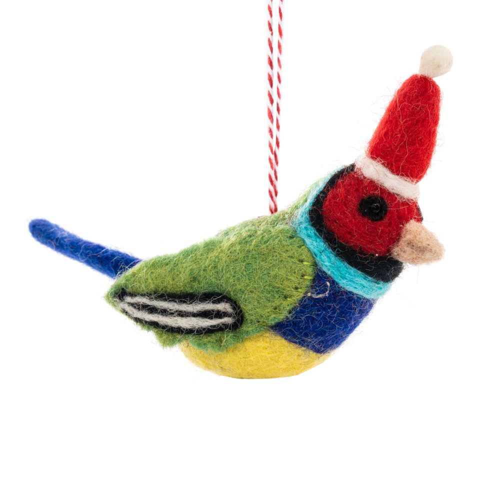 A colourful felt bird ornament wearing a red Santa hat against a plain white background.