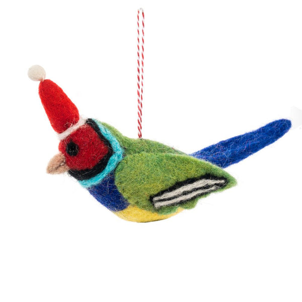 A colourful felt bird ornament wearing a red Santa hat against a plain white background.