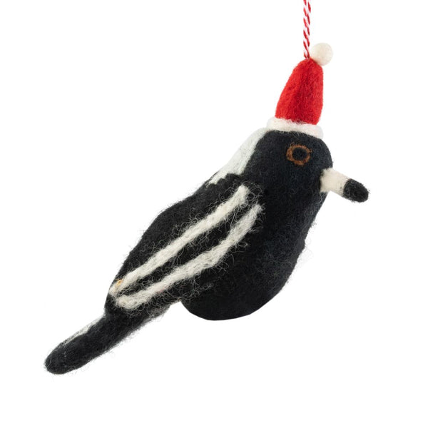Felted bird ornament with a Santa hat on a white background