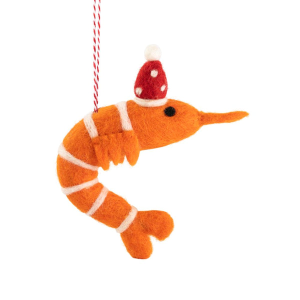 An orange felt prawn ornament wearing a Santa hat, hanging  by a red-and-white string, shown on a plain white background.