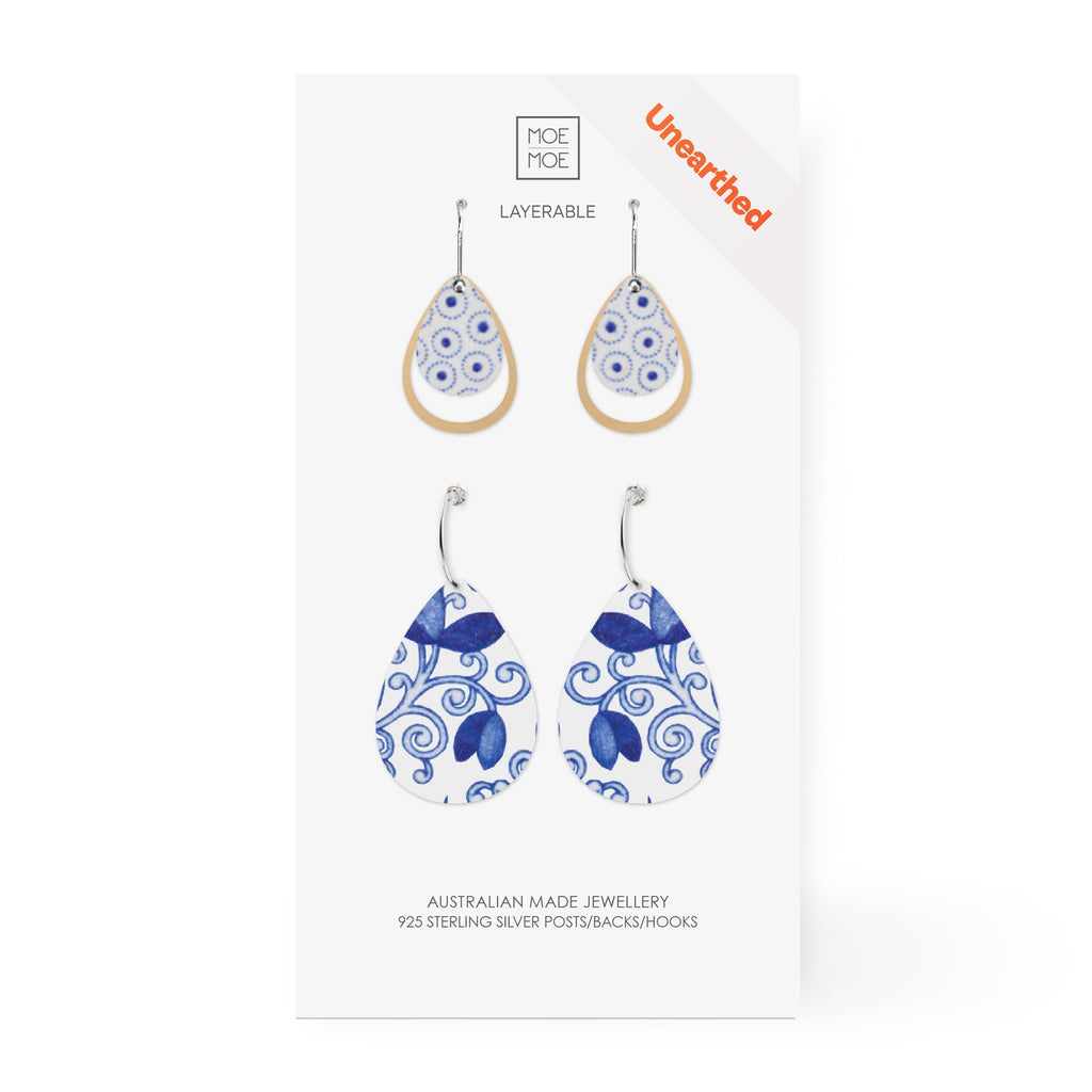 Two pairs of drop earrings featuring a blue and white pattern