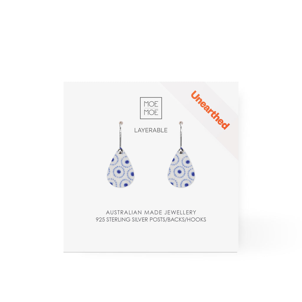 Tear drop shaped earrings featuring a blue and white pattern