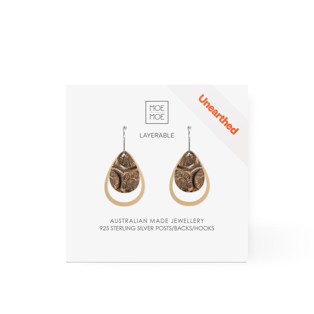A pair of layered tear drop earrings featuring a pattern created from a digital image from the archaeology collection at Museum of Sydney