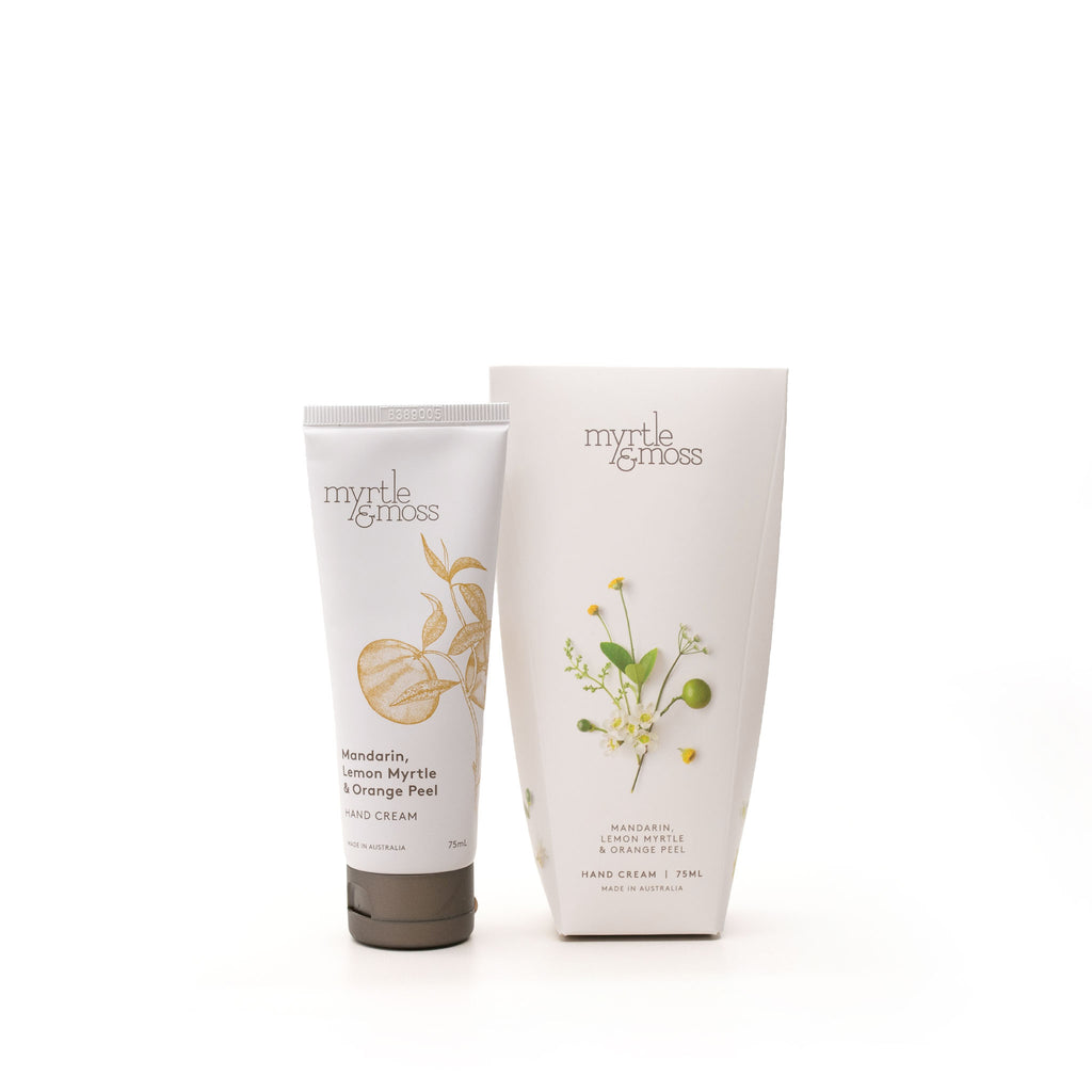 A tube of Myrtle & Moss hand cream next to its cardboard packaging.