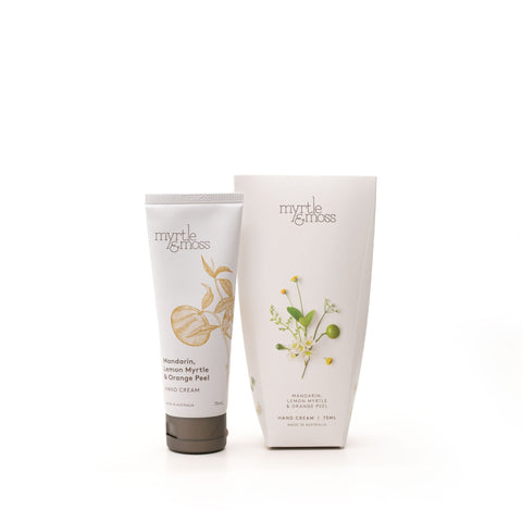 A tube of Myrtle & Moss hand cream next to its cardboard packaging.