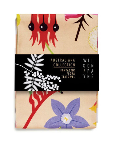 A tea towel with a floral design featuring Australian native plants.