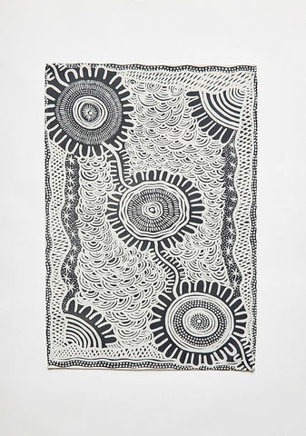 A black and white Indigenous artwork printed tea towel by Coomaditchie artist Allison Day.