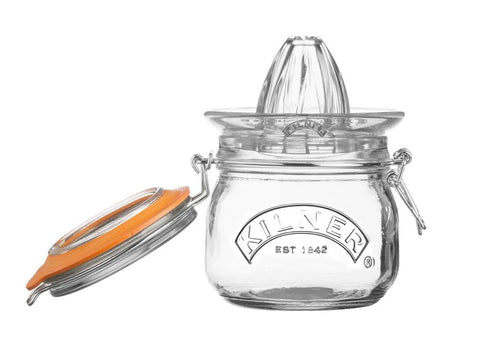 Glass juicer with hinged lid with metal fastener in a retro design and Kilner branding embossed on the front.