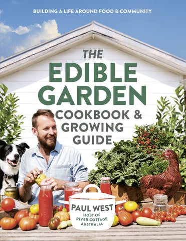 The cover of 'The Edible Garden Cookbook & Growing Guide' by Paul West features a vibrant image of the author in a garden setting, surrounded by a variety of vegetables and a dog and chicken.