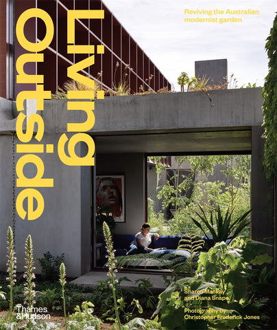 Cover of the book 'Living Outside' featuring a modern residential garden with a with plants and a contemporary house in the background.