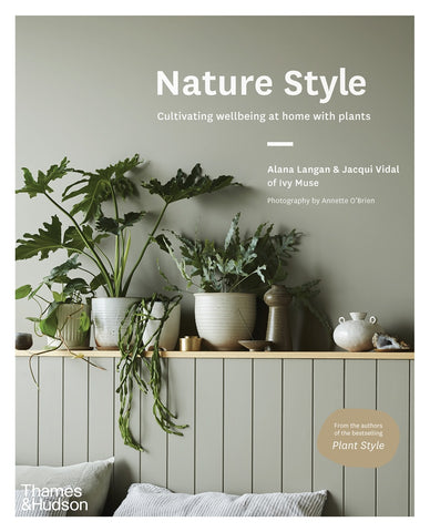 The cover of the book 'Nature Style' featuring the title with an image of various houseplants on a shelf in a stylish setup.