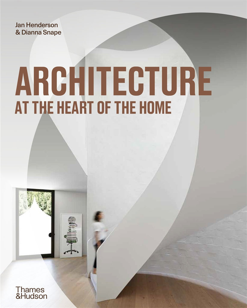 Cover of the book 'Architecture at the Heart of the Home' featuring a white interior space with a dramatic curving staircase.