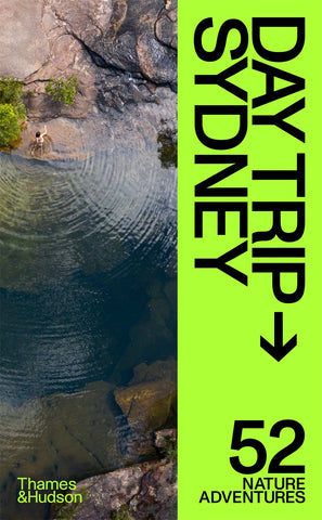 The cover image of the book 'Day Trip Sydney: 52 Nature Adventures' featuring an aerial view of a body of water with rocks around.