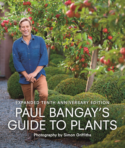 Cover of the book 'Paul Bangay's Guide to Plants: Tenth Anniversary Edition' featuring a photograph of Paul Bangay standing in a garden with apple trees.