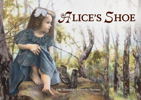 Book cover of 'Alice's Shoe' featuring an illustration of a child with a shoeless foot raised, sitting on a rock with trees in the background.