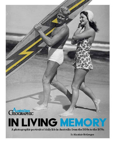 A black and white cover image of a book titled 'In Living Memory', featuring a vintage photograph of a man and a woman with a surfboard, capturing a moment of everyday life.