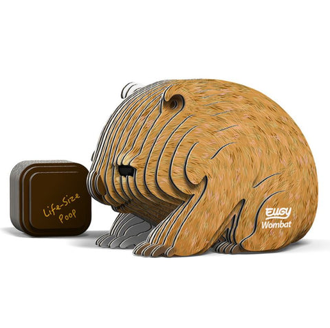 A 3D cardboard model kit of a wombat, with the assembled model displaying a lifesize poop.