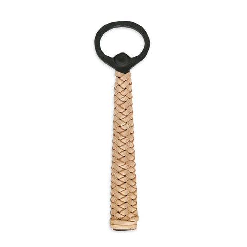 A bottle opener with a blackened iron handle and woven leather grip.