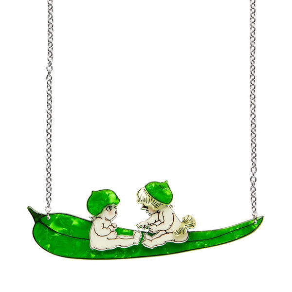 An Erstwilder May Gibbs necklace featuring a layered resin pendant with two Gumnut Babies, riding on a green gumleaf boat.