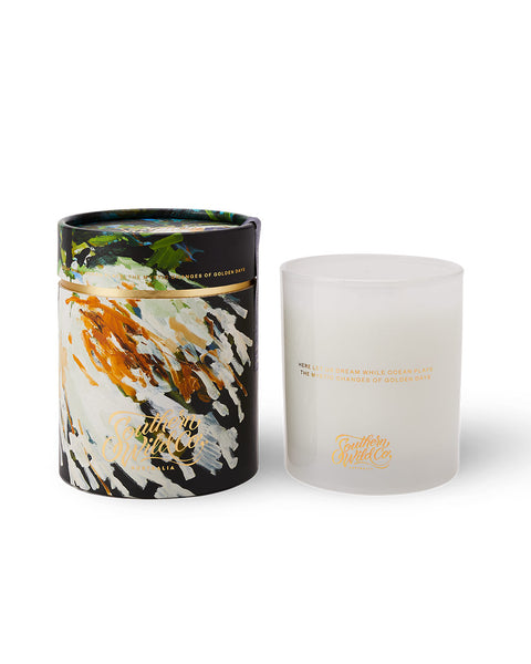 A large soy wax candle with a colourful  recyclable kraft paper tube packaging.