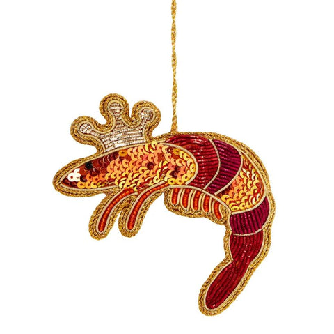 A sequined decoration in the shape of a crowned king prawn in a red and gold color scheme, with lightweight beading.